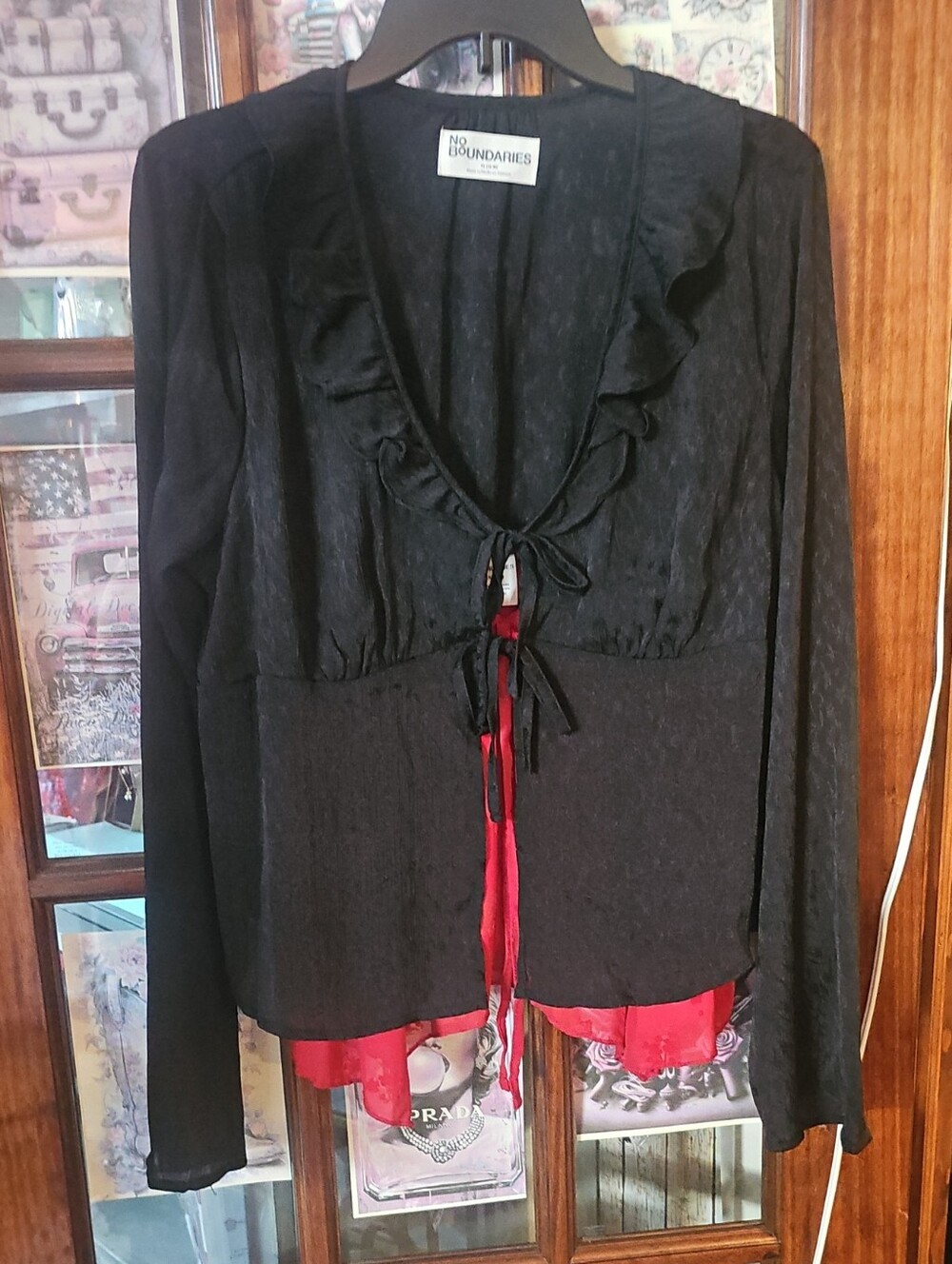 No Boundaries Black Long-Sleeve Ruffle Tie-Front Top with Red Hem Detail